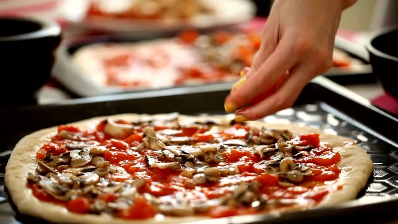 Fresh New York-style pizza made with dough prepared daily at New York Pizzeria Calgary and Okotoks